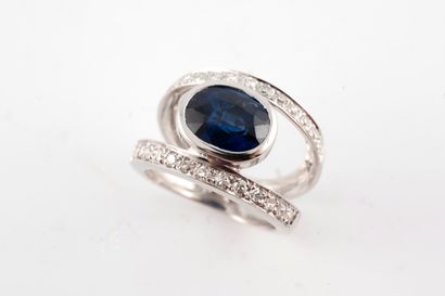 null 18k white gold eye ring centered with an oval spinel in closed setting between...
