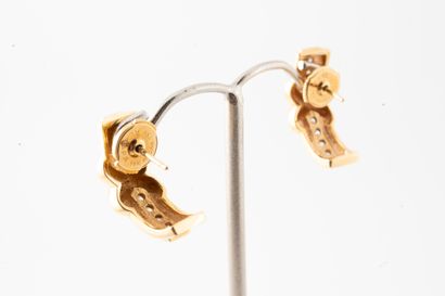 null Pair of earrings in 18k yellow and white gold with bow motif and centered by...