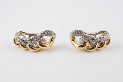 null Pair of 18k yellow and white gold ear clips formed by gourmet links partially...