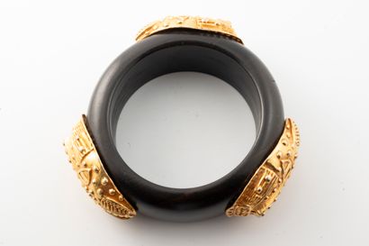 null DOMINIQUE AURIENTIS 
Circa 1980
Ebony bangle bracelet adorned with African leopard...