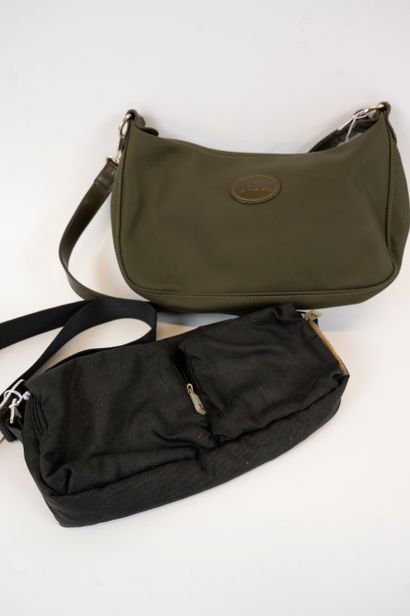 null Lot including two bags:
- LONGCHAMP A small forest-green canvas bag with shoulder...