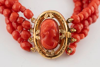 null Bracelet with four rows of faceted coral beads. Coral cameo clasp depicting...