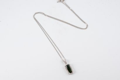 null Pendant and chain in 18k white gold adorned with an emerald-cut tourmaline weighing...