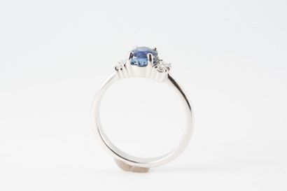 null 18k white gold ring set with a natural oval sapphire weighing 1.44ct in intense...
