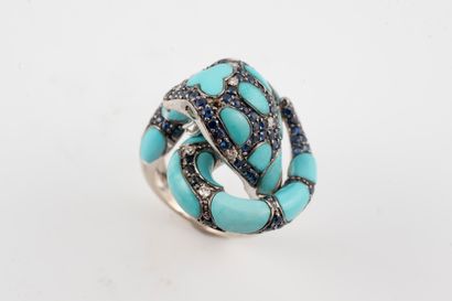 null Intertwined snake ring in 18k white gold paved with turquoise and sapphires...