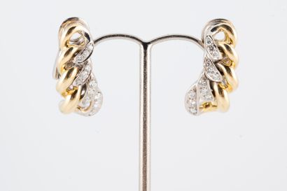 null Pair of 18k yellow and white gold ear clips formed by gourmet links partially...