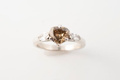 null 18k white gold ring set with a heart-cut cognac diamond approx. 0.60cts framed...