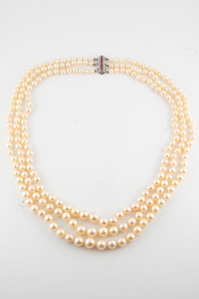 null Necklace with three rows of tumbling cultured pearls and a platinum clasp adorned...