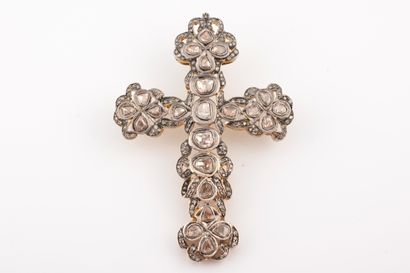 null An important silver vermeil cross pendant, topped with 24 irregular-cut diamonds,...