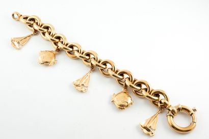 null 18k yellow gold marine link bracelet holding 5 dangling charms featuring gold...