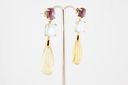 null A pair of 9k gold and vermeil earrings featuring a star ruby cabochon holding...