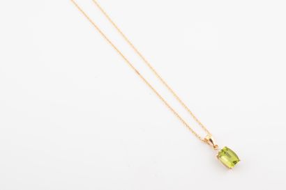 null 18k yellow gold pendant set with a faceted cushion-cut peridot weighing approx....