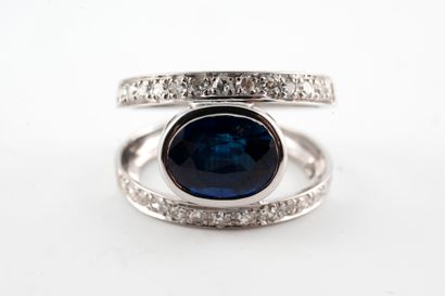 null 18k white gold eye ring centered with an oval spinel in closed setting between...