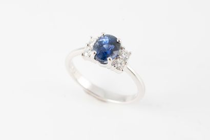 null 18k white gold ring set with a natural oval sapphire weighing 1.44ct in intense...