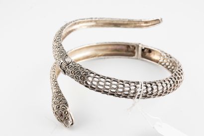 null Openwork silver bangle representing a coiled snake entirely set with marcasites.
Gross...