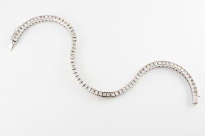 null 18k white gold rivière souple bracelet set with 74 princess-cut diamonds, approx....