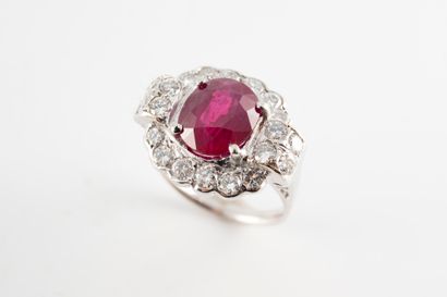 null 18k white gold ring set with a 3ct ruby in a geometrical shape entirely set...