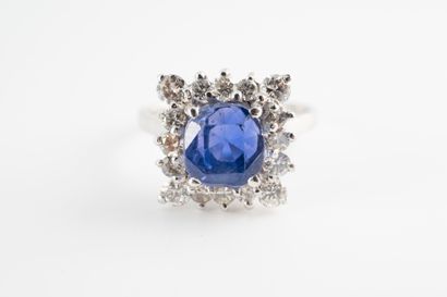 null 18k white gold ring set with a 4.35cts natural Ceylon sapphire on a square bezel...