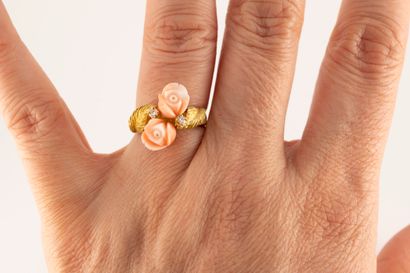 null 18k yellow gold ring featuring two angel-skin coral flowers set with two diamonds,...