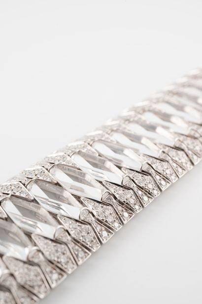 null Superb 18k white gold cuff bracelet formed by a line of diamond-cut crystals...
