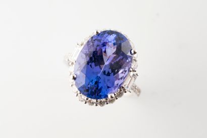 null 18k white gold ring centered on a large oval tanzanite weighing approx. 10cts...