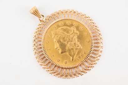 null 18k yellow gold pendant adorned with a $20 "Liberty Head - Double Eagle" coin...
