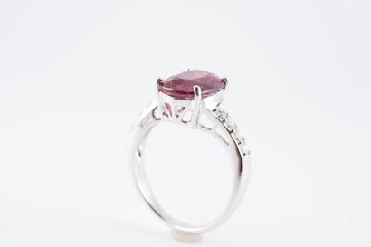 null 18k white gold ring set with an oval ruby in a line of brilliant-cut diamonds.
Gross...