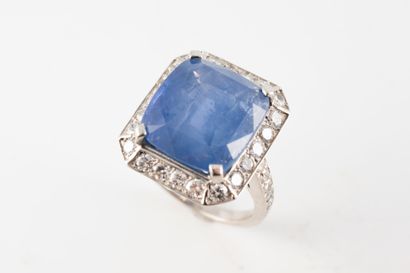 null 18k white gold ring centered on a large cushion-cut sapphire weighing 12.89...