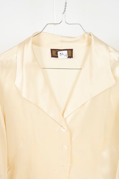 null RENATO NUCCI and ERIC BOMPARD 
Set of two silk blouses: 
- ERIC BOMPARD A dark...