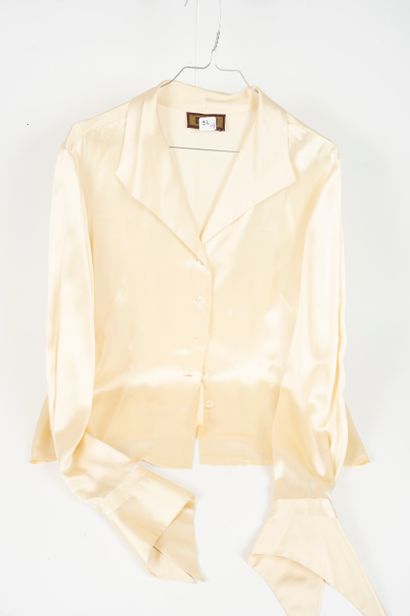 null RENATO NUCCI and ERIC BOMPARD 
Set of two silk blouses: 
- ERIC BOMPARD A dark...
