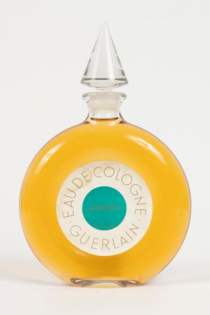 null GUERLAIN "Eau de Cologne Mitsouko".
Glass bottle, watch model, titled label....