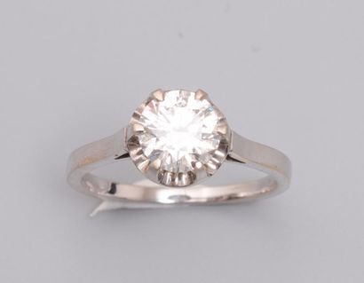 null Bague en or gris 750MM et , platine 900 MM, ornée d'un beau diamant rond pesant...
