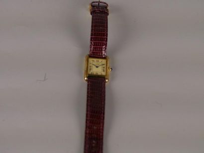  CARTIER - montre dame - Plaquée or numérotée 15020 - Bracelet en cuir noir - Années...