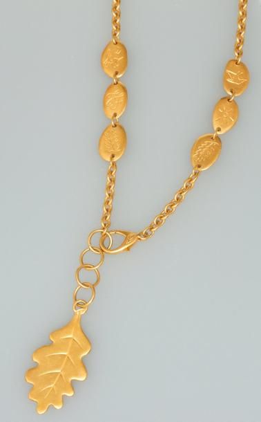 null Inès de la FRESSANGE. Collier - Ceinture doré, dans pochette, 1996, 