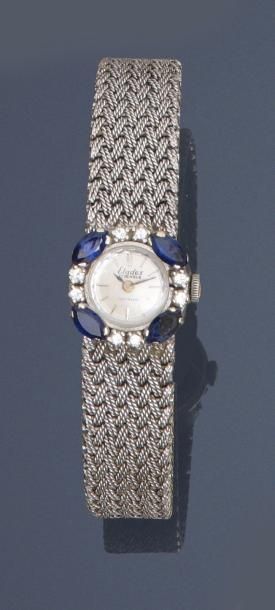null ELADEX. Bracelet montre de dame en or gris, 750 MM, lunette ronde, entourée...