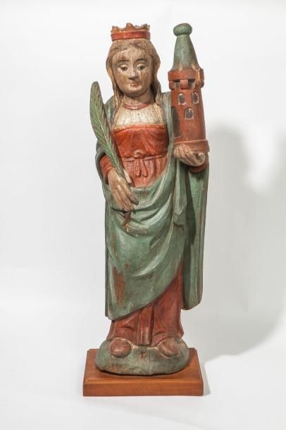 null Sculpture en bois polychrome représentant sainte Barbe. Rare iconographie qui...