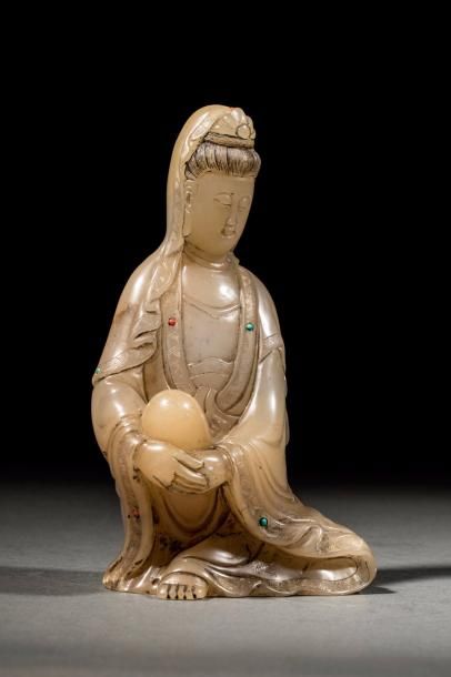 Le Boddhisattva Kwan Yin assis en délassement...