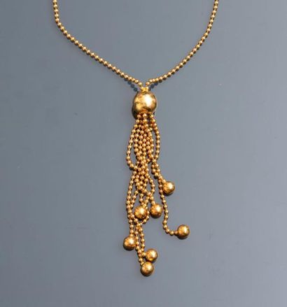 null Joli collier de petites perles d'or jaune portant un pompon en perles d'or jaune,...
