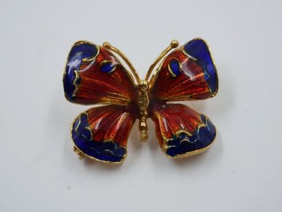 null Broche papillon en or jaune 18k, les ailes décorées d'émail bleu et d'émail...