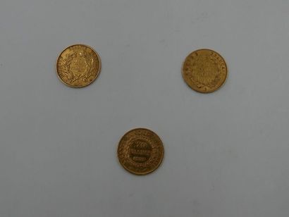 null Trois pièces de 20 francs en or dont : 1 pièce à l'effigie de Napoléon III Empereur...