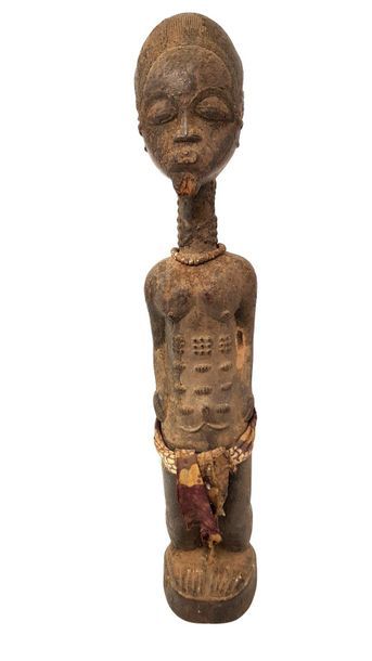 Statuette Baoulé Pagne de tissus, collier de perles H : 38 cm.

Provenance : Ancienne...