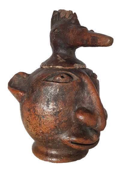 Vase au visage d’homme Covered vase surmounted by a bird's head, glazed terracotta...