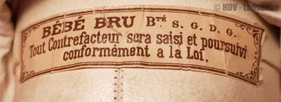 Très beau bébé BRU 
Swivel head on porcelain bust marked "Bru Jne 9" and Bru 7 on...