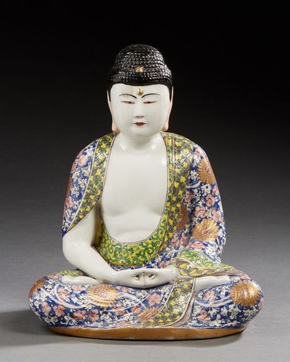 JAPON 
Figurine en porcelaine représentant un bouddha assis en lotus.
XXe siècle.
Dim.:...