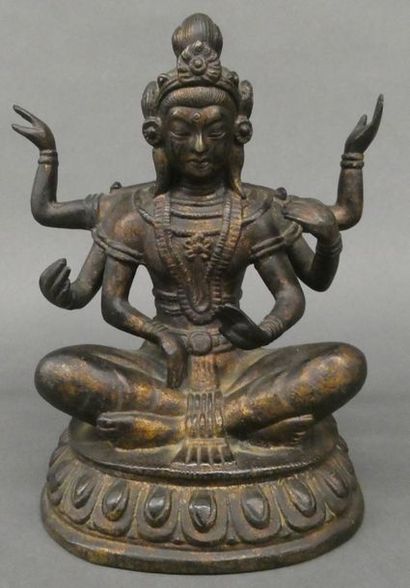 null Groupe en bronze figurant une divinité du panthéon bouddhique à six bras


H:...
