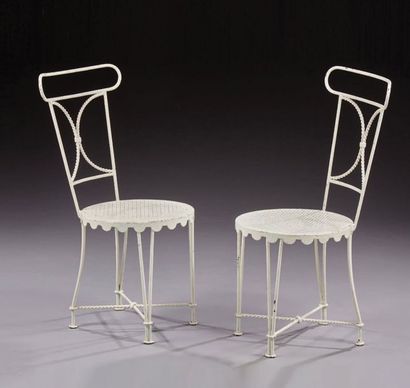 Gilbert POILLERAT (1902-1988) 
Pair of neoclassical chairs in white lacquered wrought...