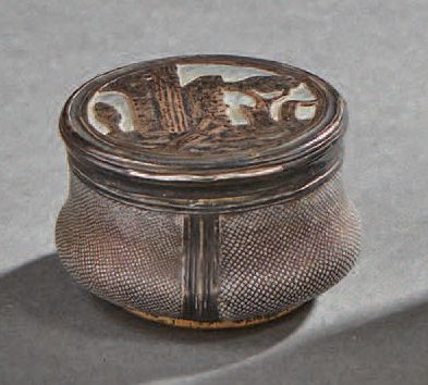 null Small circular silver box in shagreen; the lid decorated with ruins and trees...