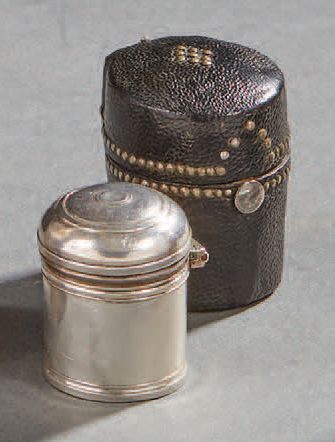 null Small silver ointment jar in its black studded leather case.
French work from...