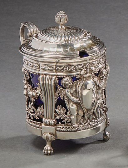 null Silver mustard pot, decorated with cherubs supporting a medallion, fruit and...