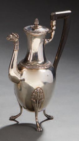 null Ovoid pourer in plain silver, standing on three feet with acanthus leaves attachments,...